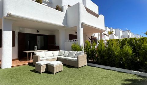 Situated in the esteemed first phase of Mar de Pulpi, this ground floor apartment exudes immaculate elegance and luminosity. The interior comprises a spacious lounge/dining area with sliding doors opening to the south-facing terrace and private garde...