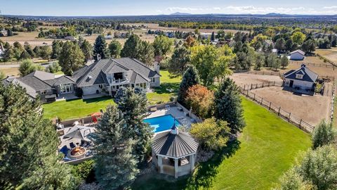 Welcome to an exceptional estate in Centennial, Colorado, catering to car and horse enthusiasts alike. This home is set against a stunning backdrop of mountains and city views. This 6-bedroom, 5-bathroom home seamlessly blends luxury, entertaining an...