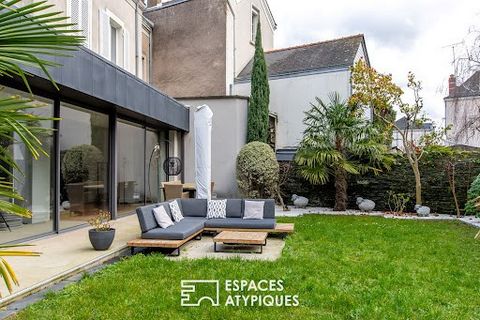 Located in a popular area of Angers, this spacious house of 324 m2 offers a cozy garden on a plot of approximately 335m2. This building embodies the perfect marriage between traditional charm and modernity to create a warm and welcoming atmosphere. O...