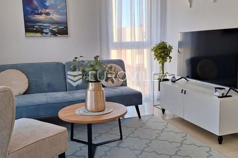 Istria, Poreč, for rent is a modernly furnished apartment on the first floor with two bedrooms, a terrace, and an associated parking space. The 60 m2 apartment consists of two bedrooms, a kitchen integrated into the living room with top appliances, a...