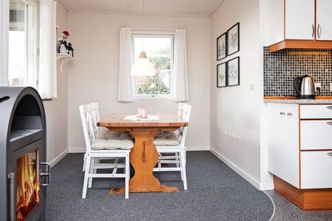 Insulated holiday cottage to be used all year round. Situated in a green, luxuriant garden with a big lawn and several sunny, secluded spots and terraces. Living room and kitchen are connected and have a view to the Vejle Fiord. Bath/WC with underflo...