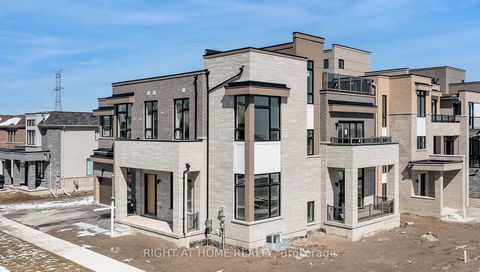 Welcome to 3 Clipper Lane! A never-lived-in luxurious, extravagant, & huge modern waterfront home in a brand new community w/ 5 beds, 6 baths, finished basement with 1-bed & 2-rec rooms, elevator servicing each floor, and astonishing balcony-direct v...