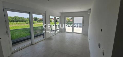 PRIVLAKA-SABUNIKE (ZADAR SURROUNDINGS) -- TWO-ROOM APARTMENT ON THE FIRST FLOOR WITH A HUGE TERRACE   S3   A spacious apartment in a new building is for sale, the completion of which is expected in May 2024. The apartment is located on the first floo...