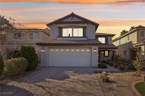 Nestled in the prestigious, guard gated Royal Highlands neighborhood of Las Vegas, this elegant home exudes timeless charm and modern convenience. The inviting kitchen, featuring sleek granite countertops and a breakfast bar, seamlessly connects to t...