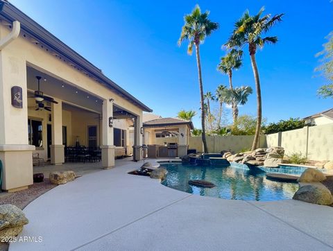 Welcome to your VERY OWN PRIVATE RESORT ! This outdoor Living space has it ALL ! There is a LARGE PRIVATE POOL, w/ BUILT-IN SPA and WATERFALL feature * A COVERED RAMADA with a Built in Grill, Drink Cooler, and Prep area to ENTERTAIN IN STYLE ! The ST...