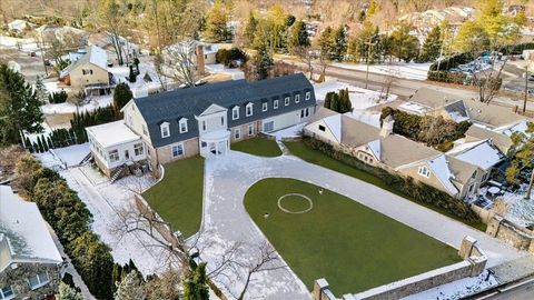 As you approach the sweeping circular driveway you're immediately drawn to the tasteful elegance of this stone colonial situated on .74 acres. The Belgium block detail, exterior stone wall and Vermont slate roof create a feeling of elegance and grand...