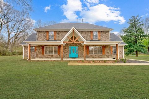 Discover this exquisite 5-bedroom, 4-bathroom 2-story brick home, perfectly situated on 2.05 acres. Boasting a sleek aesthetic with high-end renovations, this home is a true showstopper. Step inside to an open floor plan featuring fresh neutral paint...