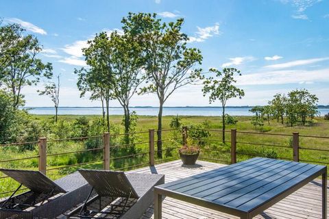 On the peninsula Lundø, which is located in the southern part of the Limfjord, is this cottage with panoramic views of the water, which can be enjoyed both from the house and the terrace. By the large, covered terrace there is a large wilderness bath...