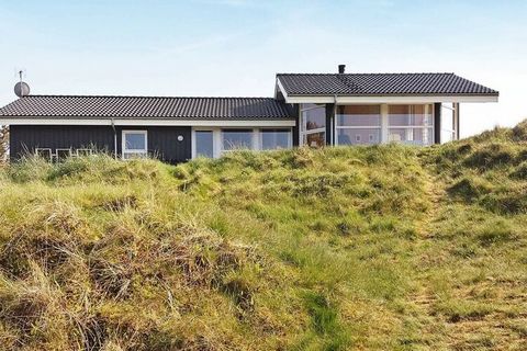 A holiday cottage with whirlpool and sauna in one of the bathrooms. The house is located at a cul-de-sac on a large natural plot with peaceful surroundings and a view of the sea. In the elevated living room there are large panoramic windows facing th...