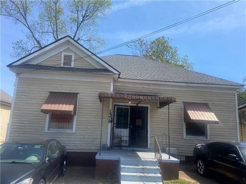 Great opportunity available. What was once an upholstery shop, is now a mixed use property. Bring your commercial or residential ideas onboard. There are four bedrooms and one bathroom. There is also a kitchen, as well as a spacious garage storage ar...