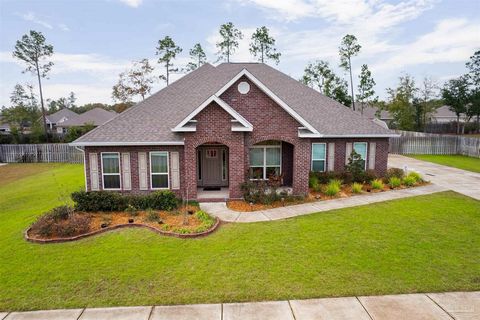 Wow! Take a look at this gorgeous 5 bdrm, 3 bath brick dream home on a half acre lot in the sought after Ashley Plantation community! This home features wood-look flooring throughout main living area, eat in kitchen with granite countertops, island, ...