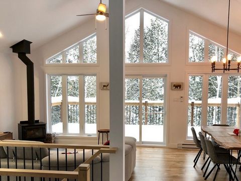 This magnificent Scandinavian-style buildable property, with a living area of 1248 sq. ft. is located on a wooded lot of 72,662 sq. ft. Perched on the cliff with a stream at the foot of the mountain, it will offer you a breathtaking view of the mount...