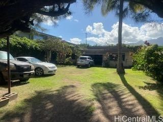 Located in Waialua on a quiet loop, this unique property is directly across from the privately shared gated beach access with a 1/11th interest in the beach access. Hear the sound of the ocean and smell the salt spray enticing you down to enjoy the s...