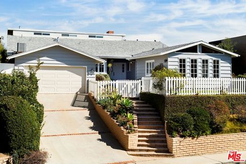 Spacious and light filled, this two story home is nestled on a peaceful street in the Marquez Knolls area of Pacific Palisades. The home features large living and dining rooms with fireplaces, and a kitchen which opens to a bright and airy great room...
