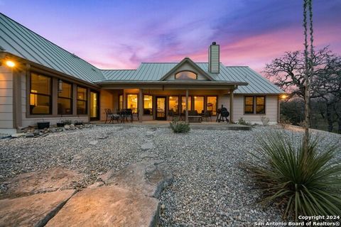 Escape to this stunning 4-bedroom, 3-bathroom Hill Country home nestled in Tierra Linda, offering a host of amenities for a luxurious lifestyle. This property boasts a Class A running horse barn, perfect for equestrian enthusiasts, as well as a heate...