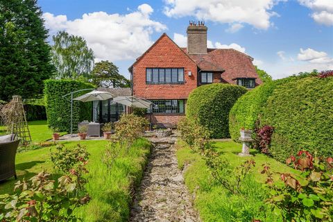 Outside, the garden is a particular feature of the property with a variety of mature trees shrubs and borders and is mainly laid to lawn. The garden features a paved terrace area to the rear of the property with steps leading to a paved path bordered...