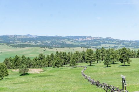 The Rafter R Ranch in Custer County, South Dakota has 400± deeded acres, a fabulous custom home, barn w/ guest house, 2 additional guest homes, large pole shed and excellent big game hunting, all just 27 miles south from Rapid City in the Black Hills...