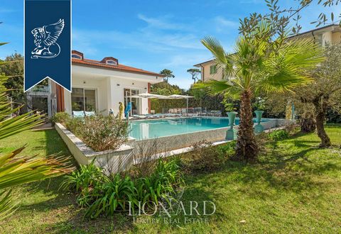 This luxurious designer villa for sale in Marina di Pietrasanta, in Versilia, is just 300 meters from the sea. Spread across three levels with 350 sqm of internal space and surrounded by a 3,600 sqm private garden, the villa offers a serene living ex...