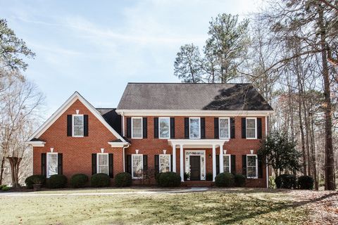 Traditional elegance exudes from this lovingly maintained brick Georgian in the coveted Jennings Mill development. Located on over an acre, the home is accented by lush landscapes and a serene water feature. A two story foyer welcomes you from a love...
