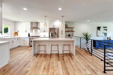 Completely Renovated for Modern Living. This stunning single-story home boasts 4 bedrooms, 2 bathrooms, w/approximately 2,237 sq. ft. of living space on a spacious 18,975 sq. ft. lot w/breathtaking hill views. Step Inside to Luxury. The gourmet kitch...