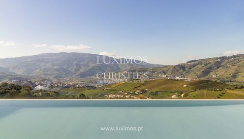 A stunning farm in the Douro Demarcated Region , in Santa Marta de Penaguião . It combines contemporary architecture with elements typical of the Douro region, such as schist exterior walls, iron railings, and Portuguese pavement at the house's entra...