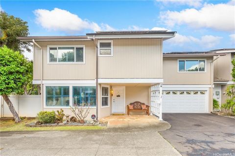 Nestled near Punahou is this highly desirable single-family cluster community with a unit available for sale! This rarely available 3 bed/2.5 bath home has metered photovoltaic panels, air conditioning, tinted double paned window, gorgeous island bar...