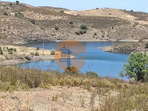 Land with 100,060m2, 10 hectares. Next to the 'CAROUCHA DAM' - in Botelhas, Castro Marim. Located next to the lake of the Caroucha Dam. Facing the Dam. Unobstructed view of the Algarve mountains and the dam lake. Land with some trees. Water, electric...