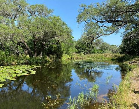 This perfect hideaway features 4.29 acres of absolute perfection. Tuck away beneath the trees, you’ll find wildflowers, wildlife and the ideal country living lifestyle. This property is fully fenced and features a stocked pond, no restrictions, septi...