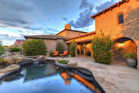 Offered turnkey furnished. Luxurious Tuscan residence located in Superstition Mountain Golf and CC, a private guard gated golf community. Incredible views of the Superstition Mountains, the Tonto Nat'l Forest, state trust lands and city lights. Built...