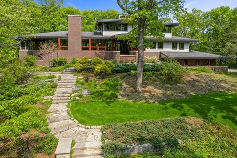 Spectacular hilltop home blends extreme quality and craftsmanship with style, comfort and easy living located on peaceful and private wooded site with tennis court. Timeless modern craftsman design created by Rehkamp Larson architects built by Doveta...