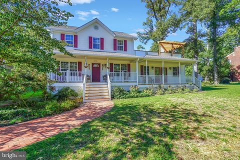 Striking the perfect balance between city home and tranquil retreat, this traditional home has almost a half acre of land and over 3,000 sq ft of finished living space. The wide front porch welcomes you and your guests and provides a great view of ma...