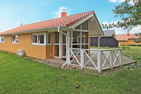 This lovely Danish-style cottage from 2011 is located in OstseeStrandpark Grömitz. The modern decor with panoramic windows, light wooden walls and sloping walls helps to make the house look bright and inviting. On cool evenings you can soak up the he...