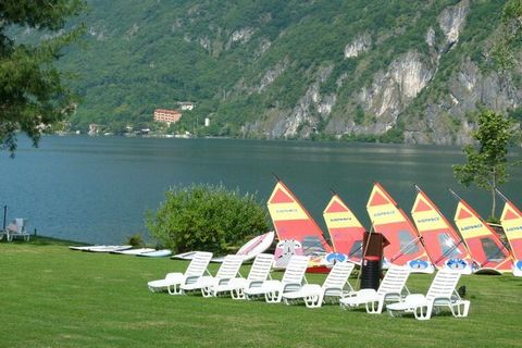 Located in Porlezza on Lake Lugano, the villa apartment is situated within the leafy parkland of Porto Letizia. The family-friendly resort enjoys a lakeside public park with meandering footpaths and a communal beach with SUP and watersport hire, 2 ch...