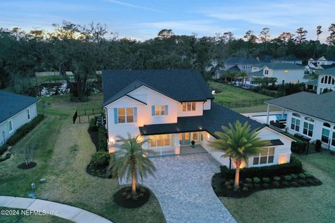 Welcome to your dream oasis in Ponte Vedra Beach, Florida, where modern coastal living meets luxurious comfort. This stunning pool home is nestled within a tranquil cul-de-sac with serene lake views. As you step inside, you are greeted with a grand 2...