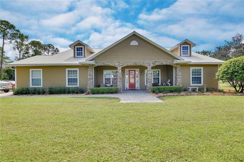 Discover the essence of luxurious country living in the heart of highly sought-after Oviedo with this stunning gated 4-acre estate. The immaculate, custom-built home features a thoughtfully designed, three-way split floor plan that encompasses 4 bedr...