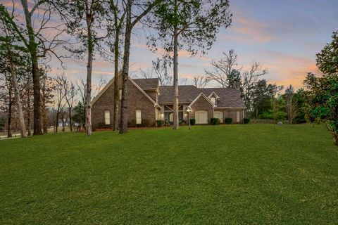 Embrace the epitome of luxury living on 3.06 acres. 4BRs, 3.5BAs and hardwood flrs that echo through each room. Feel the warmth of 4 fireplaces, relish the modern touch of smooth ceilings and discover culinary delight in the updated kitchen w/granite...