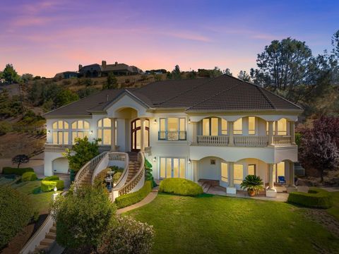 STUNNING MEDITERRANEAN GEM in SOUTHPOINTE on private 1-acre parcel with unrivaled FOLSOM LAKE PANORAMIC VIEWS from most all windows. Combining opulence and functionality, it is a home for entertaining filled with upscale features and amenities. Chef'...