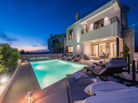 Luxury wellness villa, located in Privlaka near Zadar, just 700 meters from the sea, only 4 km from the historic town of Nin and 18 km from Zadar. Total floorspace is 190 sq.m. Land plot is 390 sq.m. The interior is carefully decorated, in a modern s...