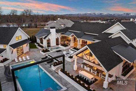 Step into luxury at Treasure Valley's most exquisite resort-style estate, nestled proudly in Eagle's gated community, Mace River Ranch. Crafted by Tradewinds, this modern farmhouse is uniquely vibrant, designed for families and offering a perpetual v...