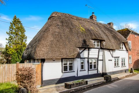 Nestled in the charming New Forest village of Rockbourne, Fordigbridge, this delightful Grade II listed thatched cottage known as 'Trentham' is a true gem. Boasting a quintessential 