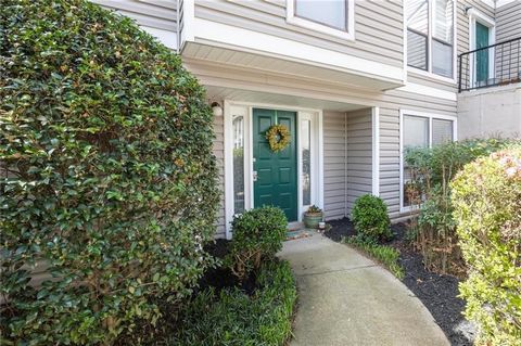 Welcome to your own private walkable wooded oasis situated on the terrace level of the beautifully landscaped Wynne's Ridge community in East Cobb! Step inside the welcoming foyer and be greeted by a spacious two-bedroom, two-bathroom layout with a u...