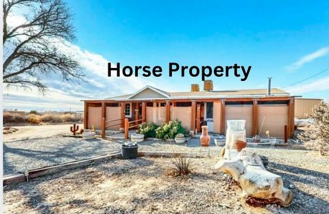 Don't miss this amazing opportunity to own your own horse property in beautiful Corrales. Sitting on almost an acre of land with incredible mountain views, this manufactured home won't last long. Outside you'll love all the pipe fencing, the 7 covere...