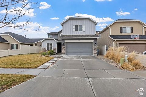 Dive into North Salt Lake perfection! This gem boasts 2 beautiful primary bedrooms, an updated ensuite bathroom and laundry room, a darling Murphy bed, and an impressive multipurpose shed with electrical and a roll-up overhead door. Enjoy a charming ...