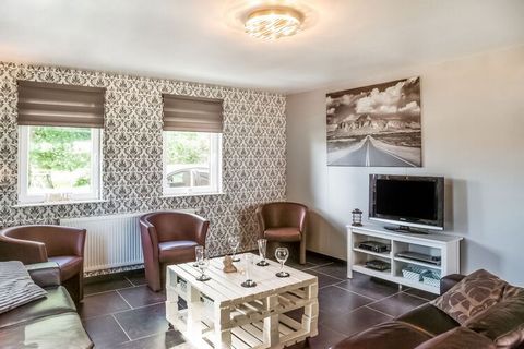 Located in the countryside of Durbuy, this 5-bedroom holiday home is pet-friendly and features an infrared sauna for relaxation. A large 14-member family with children can stay here enjoying the nearby forest. There are many activities awaiting you h...
