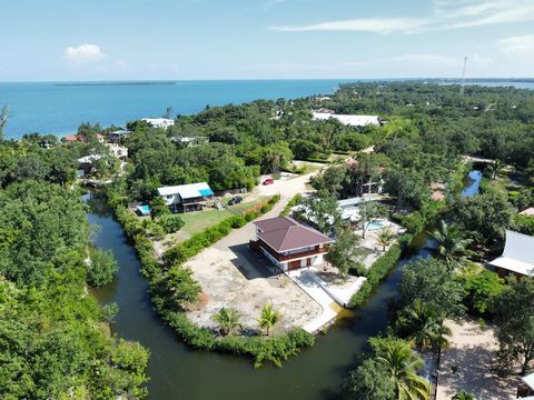 Waterfront/Canal-Access Homes Are a Rare Find on Our Tiny 16-Mile Peninsula This unique two-story home in the Amik Kil Ha Development is one of the few waterfront/canal-access homes available on our 16-mile peninsula. The property features a 53 ft 10...