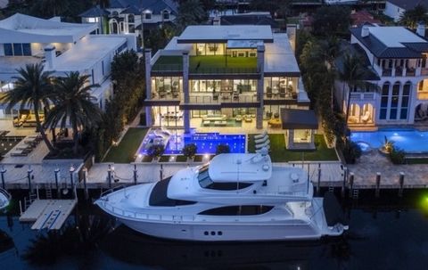 Modern luxury & class describes this waterfront estate located in the prominent neighborhood of Seven Isles just minutes from the beach and downtown Fort Lauderdale. This smarthouse is positioned on an oversized lot with 12x103 ft concrete dock and p...