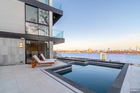Nestled atop Cliffside Park, NJ, 6 Columbia Avenue is a California-inspired architectural marvel offering panoramic views from the George Washington Bridge to the Statue of Liberty. This brand-new, multi-level home features expansive floor-to-ceiling...