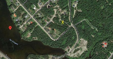 Flat and wooded lot, ready to build (Hydro-Québec on site). A 5 min walk from a beach at Lac D'Argent. INCLUSIONS -- EXCLUSIONS No certificate of location and/or soil test will be provided by the seller