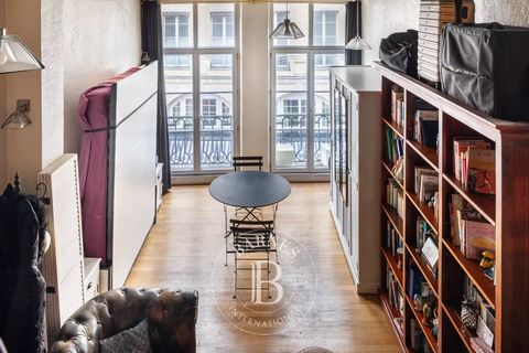 Very quiet apartment on the second floor of a Paris stone building. Its loft-style layout features a hall with plenty of storage, a fully equipped kitchen, a bright living room, an additional sleeping area on the mezzanine, a shower room and a separa...