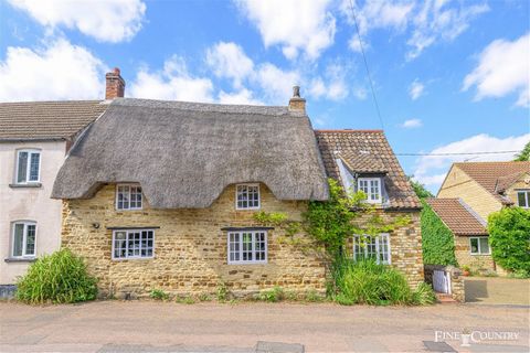 A charming, grade II listed, 17th century, stone cottage stands in the heart of the attractive village of Isham just a few miles equidistant between Kettering and Wellingborough where there are fast direct train services of under an hour to London as...